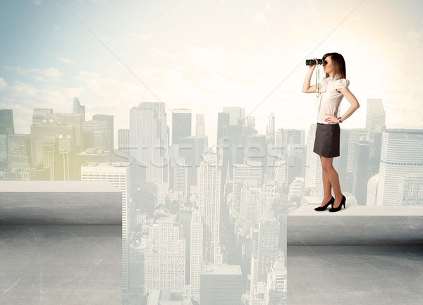 Businesswoman standing on the edge of rooftop Stock photo © ra2studio