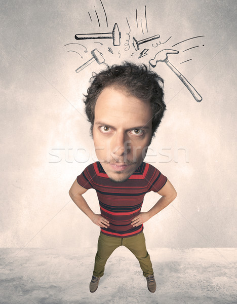 Big head person with drawn hammers Stock photo © ra2studio