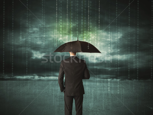 Business man standing with umbrella data protection concept Stock photo © ra2studio