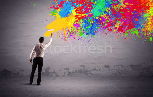 Sales person painting colorful splatter Stock photo © ra2studio
