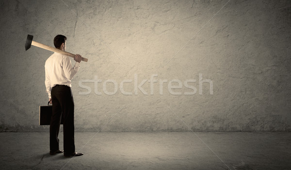 Człowiek biznesu stałego ściany młotek kopia przestrzeń Zdjęcia stock © ra2studio