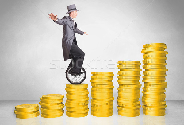 Stockfoto: Zakenman · paardrijden · omhoog · munt · grafiek · geld