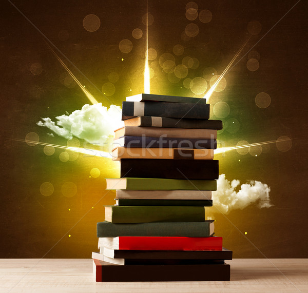 Magical books with ray of magical lights and colorful clouds Stock photo © ra2studio