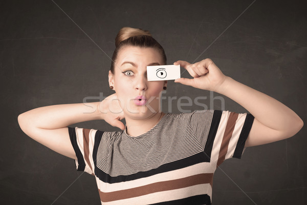 Funny woman looking with hand drawn paper eyes Stock photo © ra2studio