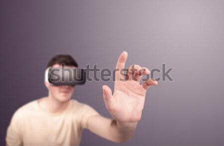 Férfi visel virtuális valóság védőszemüveg fiatal Stock fotó © ra2studio
