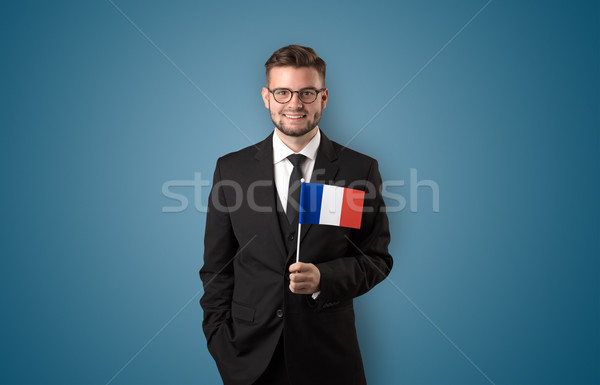 Handsome student standing with national flag Stock photo © ra2studio