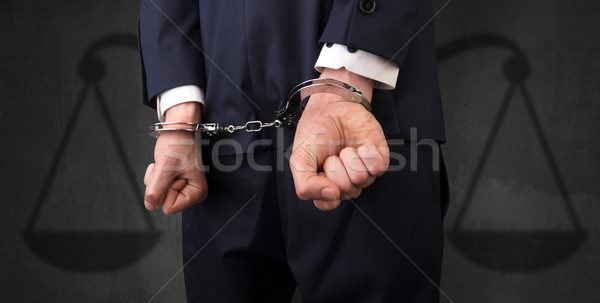 Detenido hombre equilibrio empresario esposas manos Foto stock © ra2studio