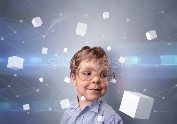 Cute kid with luminous cubes around Stock photo © ra2studio
