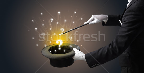 Magician conjure question signs from a cylinder Stock photo © ra2studio