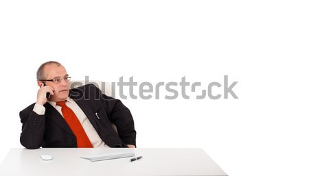 businessman sitting at desk and making phone call, isolated on white Stock photo © ra2studio