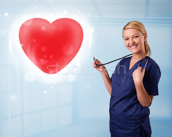 Foto stock: Jóvenes · enfermera · curación · rojo · corazón · bastante