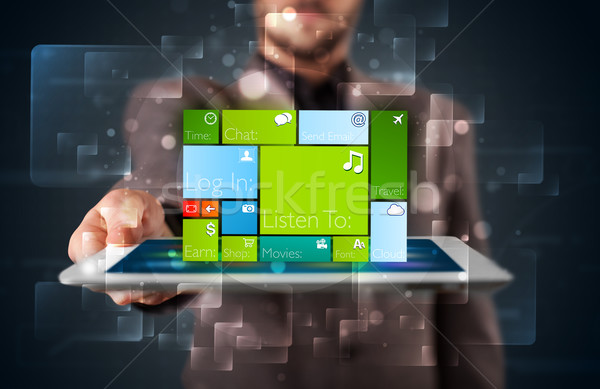 Fiatal üzletember tart tabletta modern szoftver Stock fotó © ra2studio