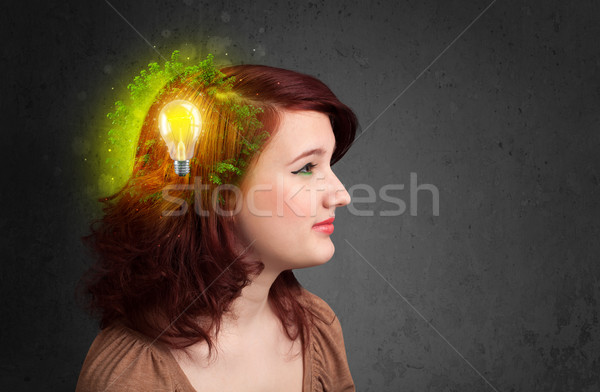 Young mind thinking of green eco energy with lightbulb Stock photo © ra2studio