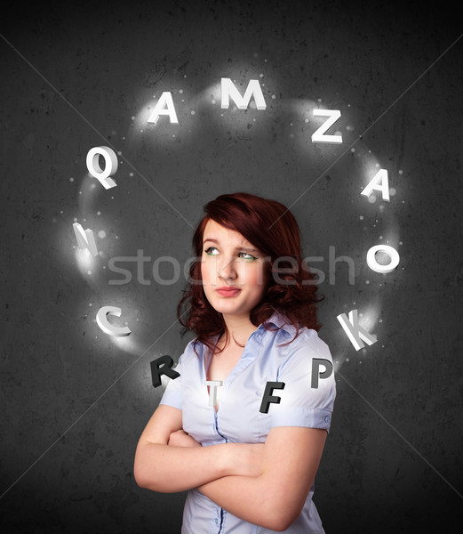 Young woman thinking with letter circulation around her head Stock photo © ra2studio