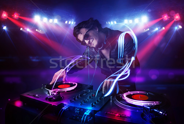 Disc jockey jugando música luz efectos Foto stock © ra2studio