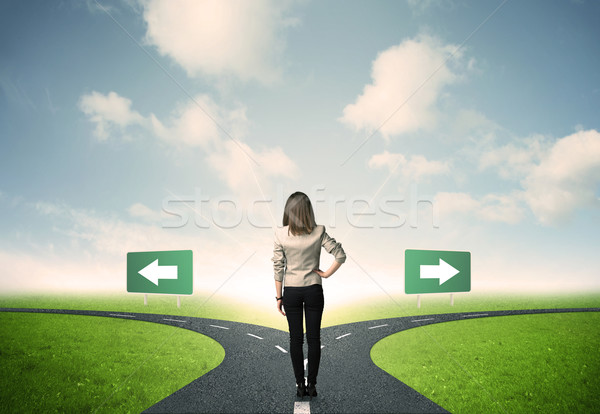 Businesswoman in front of a choice Stock photo © ra2studio