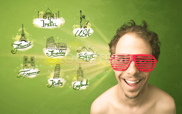 Happy young man with sunglasses traveling to cities around the w Stock photo © ra2studio