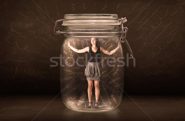Businesswoman inside a jar with powerful hand drawn lines concep Stock photo © ra2studio