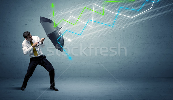 Foto stock: Empresário · guarda-chuva · mercado · de · ações · colorido · negócio