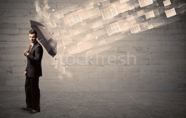 Człowiek biznesu parasol wiatr kart papieru pracy Zdjęcia stock © ra2studio