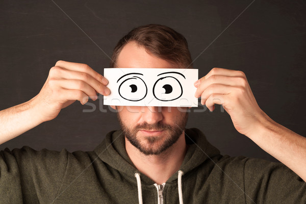 Funny man looking with hand drawn paper eyes Stock photo © ra2studio