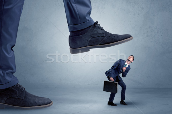 Trampled small businessman in suit Stock photo © ra2studio