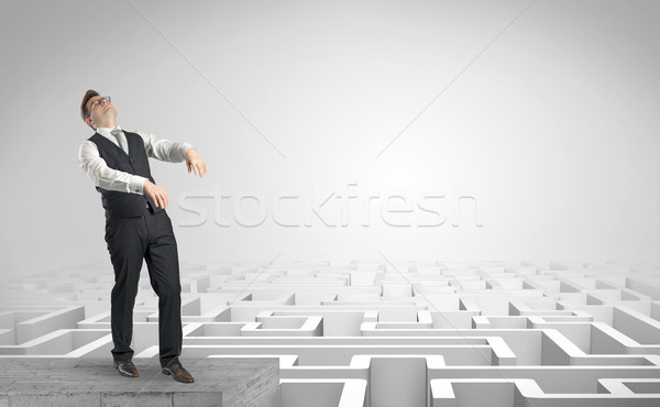 Sleepy businessman on the top of a labyrinth Stock photo © ra2studio
