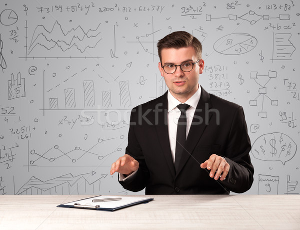 Businessman sitting at a desk Stock photo © ra2studio