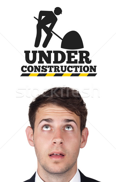 Young head looking at contruction icons Stock photo © ra2studio