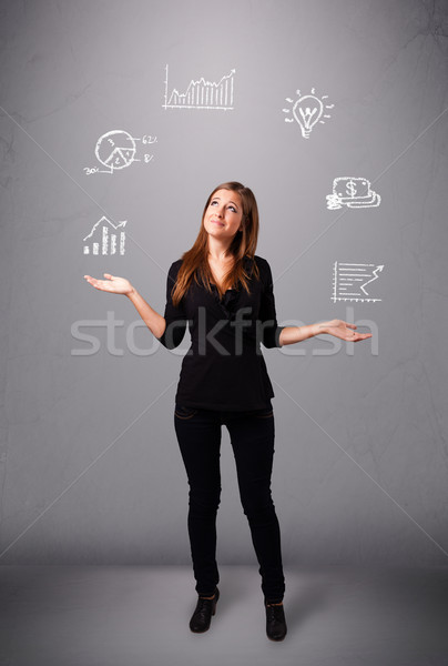 beautiful young woman juggling with statistics and graphs Stock photo © ra2studio