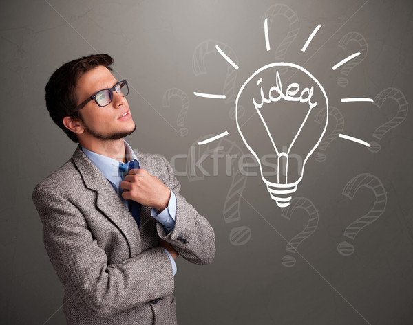 Young boy comming up with a light bulb idea sign Stock photo © ra2studio