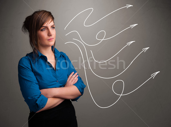 Attractive teenager looking at multiple curly arrows Stock photo © ra2studio