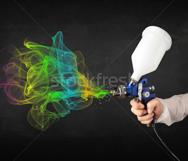 Painter working with airbrush and paints colorful paint Stock photo © ra2studio