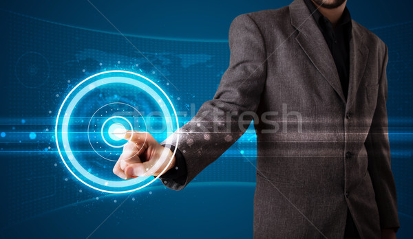 Businessman pressing high tech type of modern buttons  Stock photo © ra2studio