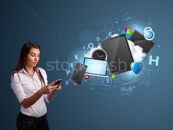 Stock photo: Pretty lady browsing on her smartphone