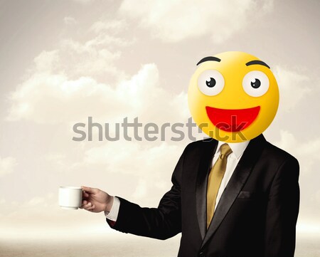 businessman wears yellow smiley face Stock photo © ra2studio