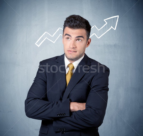 Smiling business guy with graph arrow Stock photo © ra2studio