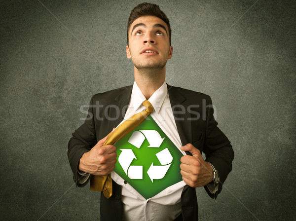 Enviromentalist business man tearing off shirt with recycle sign Stock photo © ra2studio