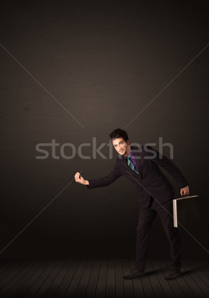Businessman making gesutres Stock photo © ra2studio