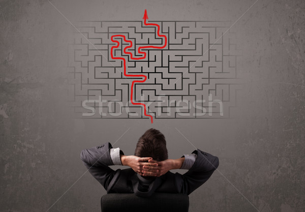 Business man looking at a maze and the way out  Stock photo © ra2studio