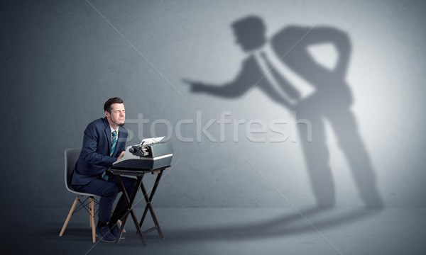 Man working hard and shadow arguing with him Stock photo © ra2studio