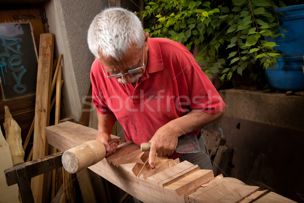 woodcarver working with mallet and chisel 7 Stock photo © ra2studio