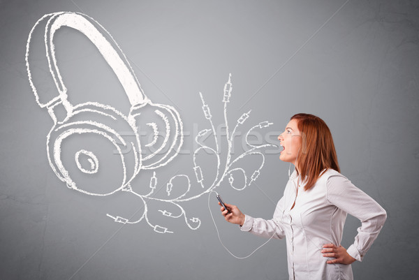 young woman singing and listening to music with abstract headphone Stock photo © ra2studio