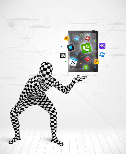 man in full body suit holdig tablet pc Stock photo © ra2studio