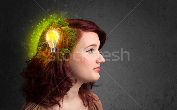 Young mind thinking of green eco energy with lightbulb Stock photo © ra2studio