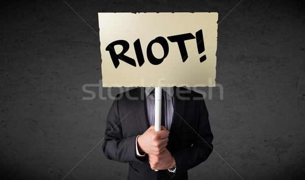 üzletember tart tiltakozás felirat demonstráció tábla Stock fotó © ra2studio