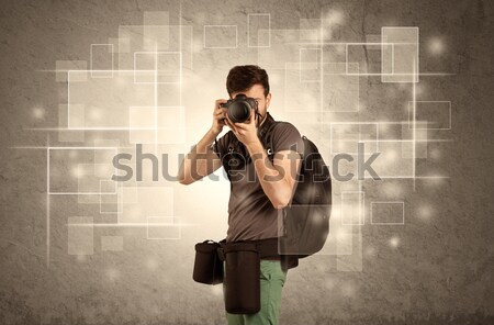 Male holdig professional camera with lens Stock photo © ra2studio