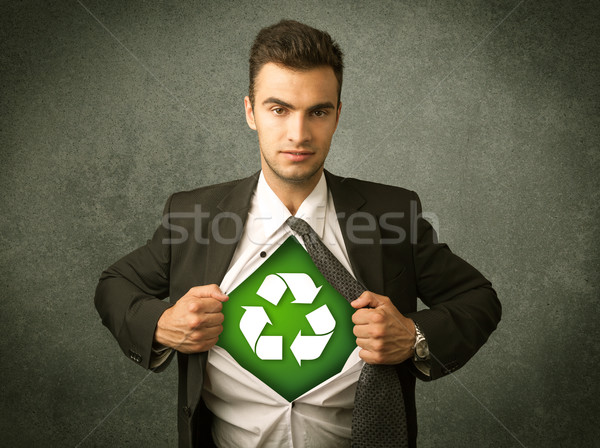 Enviromentalist business man tearing off shirt with recycle sign Stock photo © ra2studio