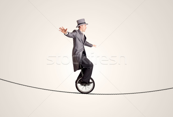 Extreme деловой человек верховая езда одноколесном велосипеде веревку бизнеса Сток-фото © ra2studio