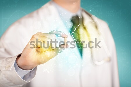 A doctor in tie holding a pill Stock photo © ra2studio